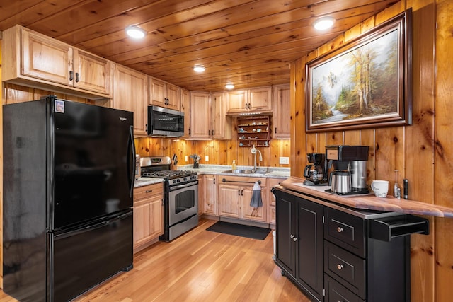 2286 Maxwell Rd, Petoskey, MI 49770 - kitchen featuring stainless steel appliances, a sink, light wood-type flooring, light countertops, and wooden ceiling