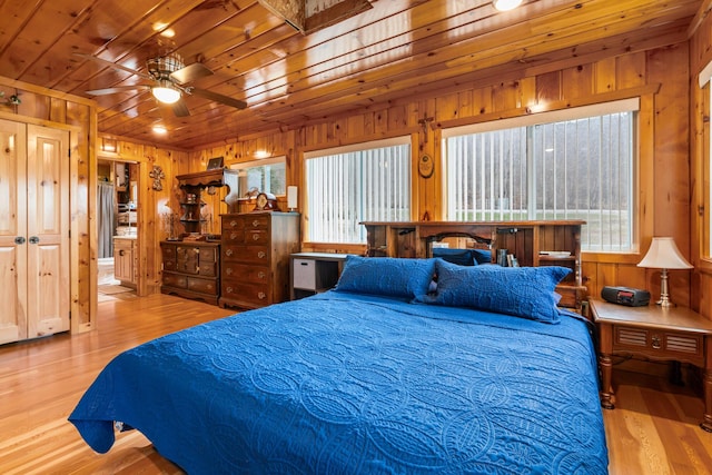2286 Maxwell Rd, Petoskey, MI 49770 - bedroom with wooden walls, wood finished floors, and wooden ceiling