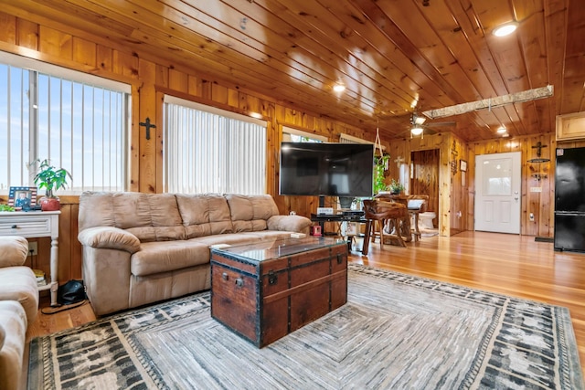 2286 Maxwell Rd, Petoskey, MI 49770 - living room with wood finished floors and wooden walls