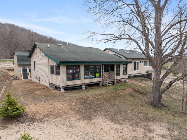 2286 Maxwell Rd, Petoskey, MI 49770 - back of property with roof with shingles