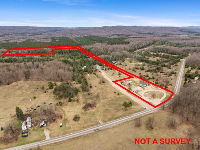 2286 Maxwell Rd, Petoskey, MI 49770 - aerial view of sparsely populated area with property parcel outlined and mountains