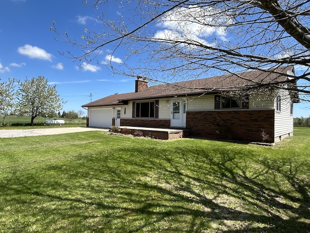 6870 N Spruce Rd, Spruce, MI 48762 - single story home with brick siding, an attached garage, driveway, and a front yard