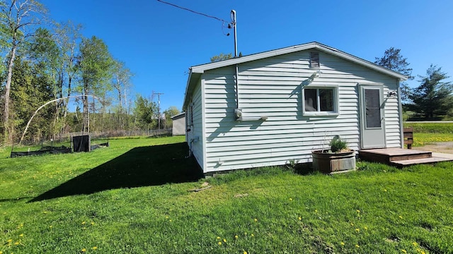 6131 N F41, Spruce, MI 48762 - view of property exterior with a lawn