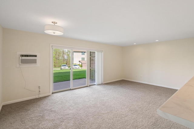 2067 Woods Ln, Petoskey, MI 49770 - carpeted empty room featuring an AC wall unit, baseboards, and recessed lighting