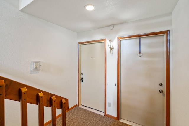 2067 Woods Ln, Petoskey, MI 49770 - carpeted entryway featuring baseboards