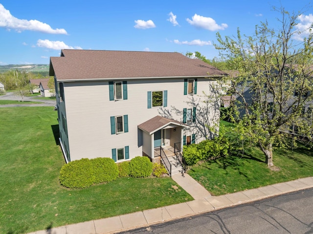 2067 Woods Ln, Petoskey, MI 49770 - view of front of house featuring a front yard