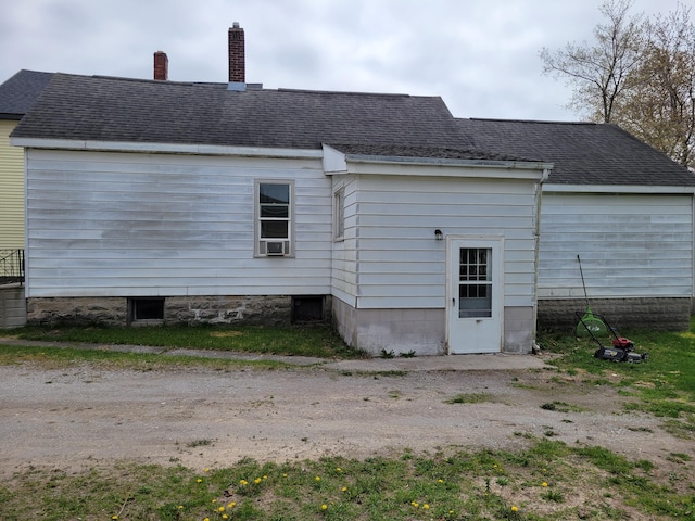 420 W Miller St, Alpena, MI 49707 - rear view of property featuring a chimney