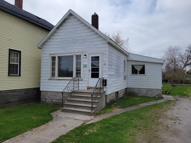 420 W Miller St, Alpena, MI 49707 - bungalow-style home with a chimney