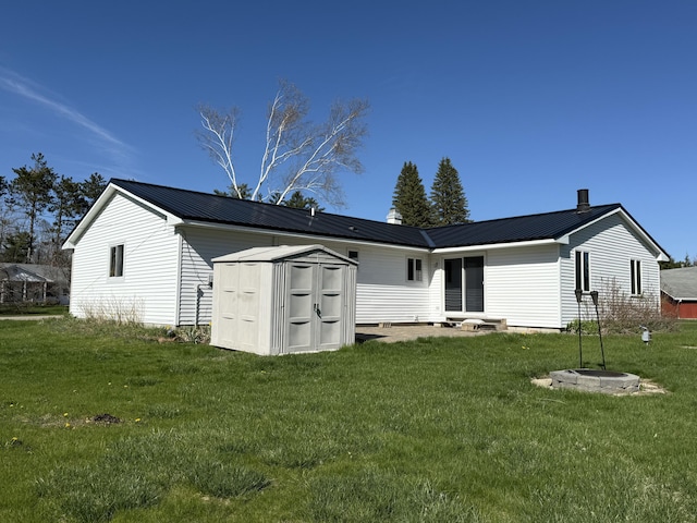 638 Snow Apple Ct, Cheboygan, MI 49721 - rear view of property with a yard and metal roof