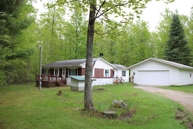 1421 W Miller Rd, Mio, MI 48647 - view of front of house with driveway and a front lawn