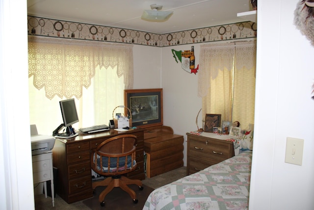 1421 W Miller Rd, Mio, MI 48647 - carpeted bedroom with a desk