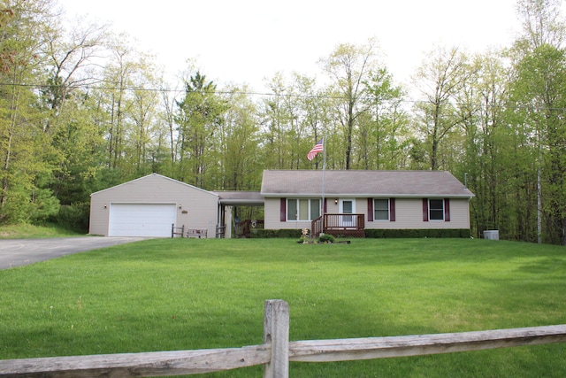 2426 W Park Rd, Mio, MI 48647 - ranch-style house featuring a front lawn and a garage