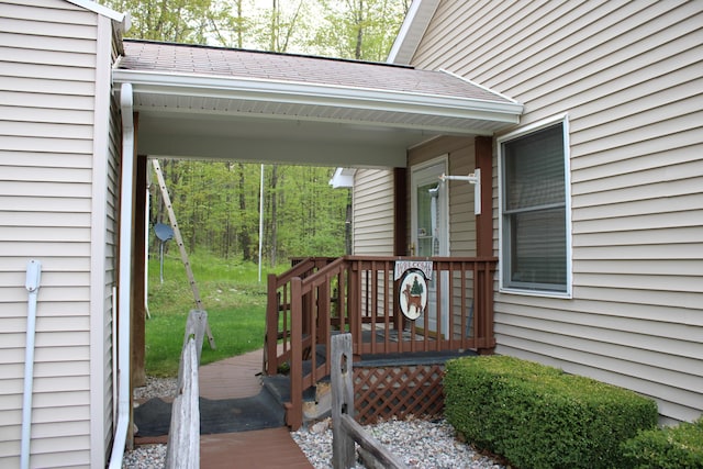 2426 W Park Rd, Mio, MI 48647 - doorway to property with a deck and roof with shingles