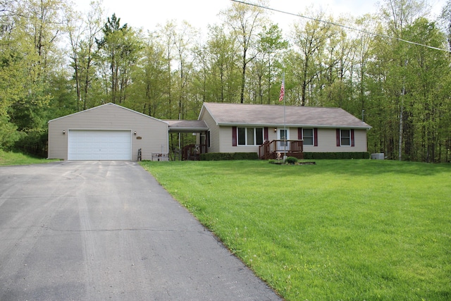 2426 W Park Rd, Mio, MI 48647 - ranch-style home featuring a garage, a front lawn, and asphalt driveway