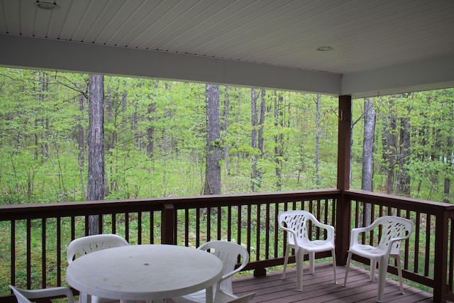 2426 W Park Rd, Mio, MI 48647 - deck featuring a forest view and outdoor dining space
