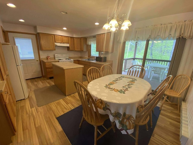 2426 W Park Rd, Mio, MI 48647 - dining area featuring light wood finished floors, recessed lighting, and a chandelier