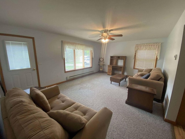 2426 W Park Rd, Mio, MI 48647 - living room featuring baseboard heating, carpet, a ceiling fan, and baseboards