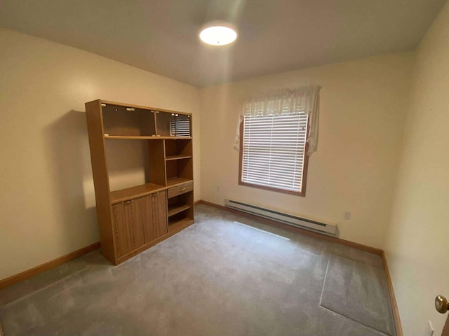 2426 W Park Rd, Mio, MI 48647 - unfurnished room with baseboard heating, light colored carpet, and baseboards