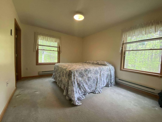 2426 W Park Rd, Mio, MI 48647 - carpeted bedroom featuring a baseboard radiator and baseboards