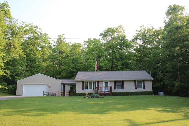 2426 W Park Rd, Mio, MI 48647 - ranch-style home with a front lawn and a detached garage
