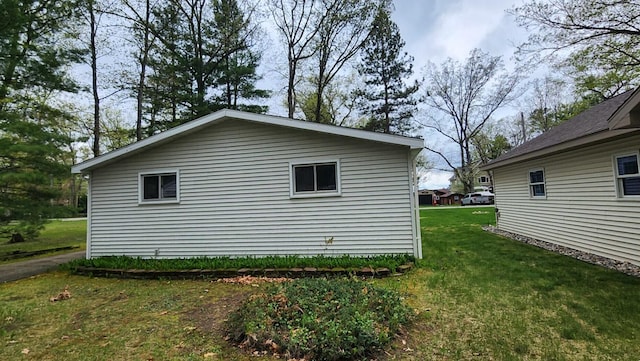 610 Old Trail Dr, Houghton Lake, MI 48629 - view of property exterior featuring a yard
