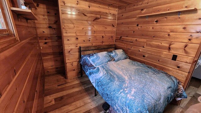 610 Old Trail Dr, Houghton Lake, MI 48629 - bedroom with wood walls and wood ceiling