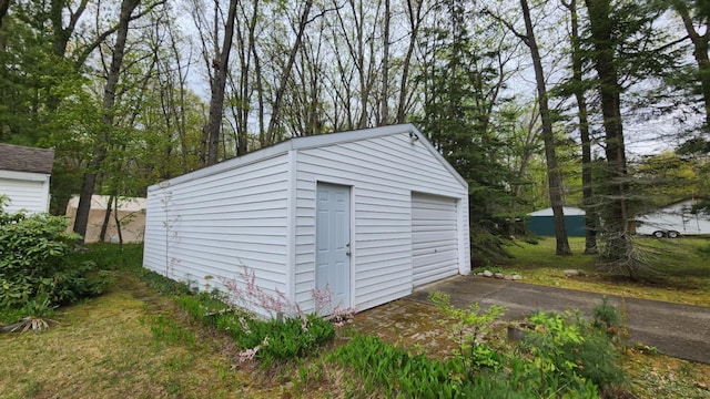 610 Old Trail Dr, Houghton Lake, MI 48629 - view of outdoor structure featuring an outbuilding