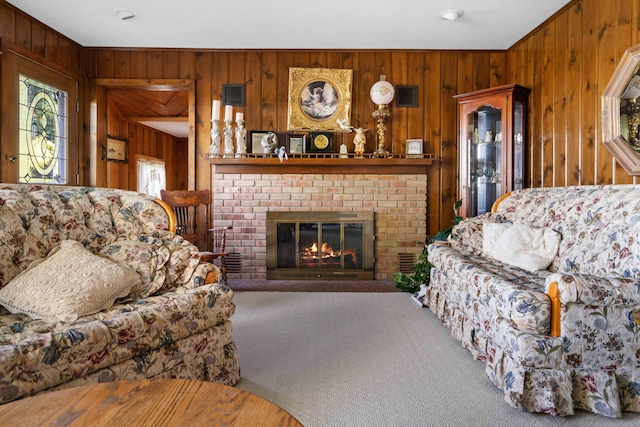 6620 N Straits Hwy, Cheboygan, MI 49721 - living room with wood walls, carpet, and a fireplace