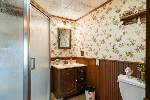 6620 N Straits Hwy, Cheboygan, MI 49721 - bathroom featuring crown molding, wallpapered walls, a wainscoted wall, a shower stall, and toilet