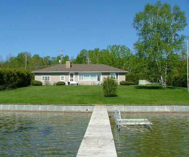 6620 N Straits Hwy, Cheboygan, MI 49721 - back of property featuring a yard, a water view, and a chimney