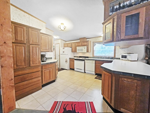 5844 Keipinger Trl, Grayling, MI 49738 - kitchen featuring white appliances, a sink, light tile patterned floors, glass insert cabinets, and brown cabinets