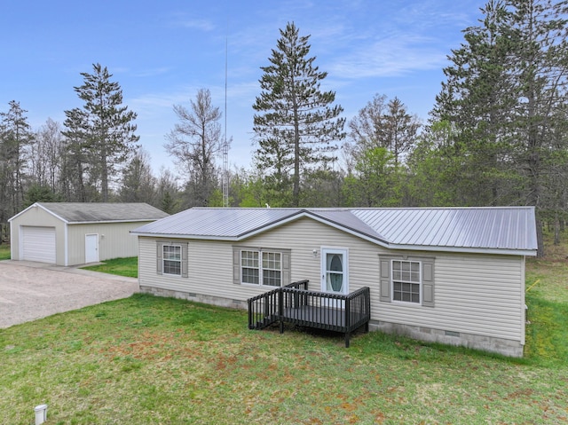 5844 Keipinger Trl, Grayling, MI 49738 - manufactured / mobile home with crawl space, a detached garage, metal roof, driveway, and an outbuilding
