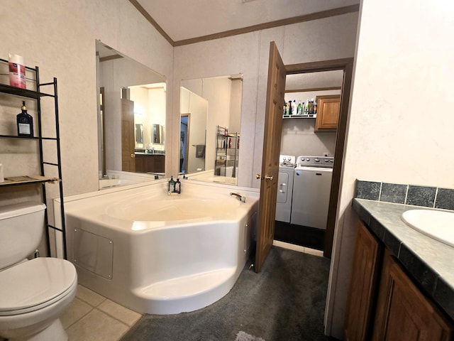 5844 Keipinger Trl, Grayling, MI 49738 - bathroom with separate washer and dryer, toilet, ornamental molding, vanity, and tile patterned floors