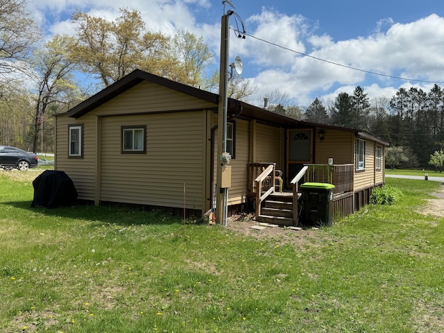 10117 M-18, Gladwin, MI 48624 - rear view of property with a yard