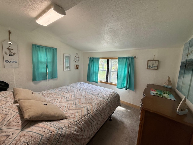 10117 M-18, Gladwin, MI 48624 - carpeted bedroom featuring a textured ceiling and lofted ceiling
