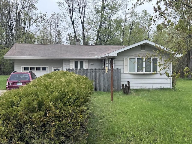 148 Sitting Bull Rd, Alpena, MI 49707 - ranch-style house with an attached garage