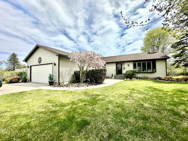 173 N Addison St, Alpena, MI 49707 - ranch-style home with driveway, a chimney, an attached garage, a front yard, and an outbuilding