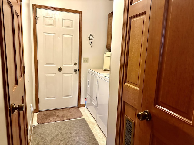 173 N Addison St, Alpena, MI 49707 - laundry room with cabinet space and independent washer and dryer