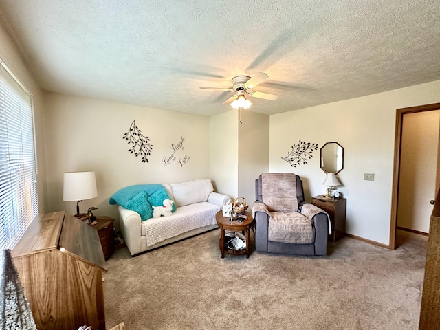 173 N Addison St, Alpena, MI 49707 - carpeted living room with ceiling fan, a textured ceiling, and baseboards