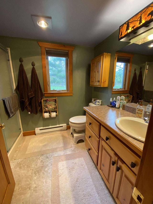5626 Smith Rd, Lewiston, MI 49756 - full bathroom featuring baseboard heating, vanity, a shower stall, and healthy amount of natural light
