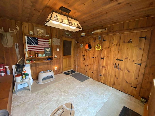 5626 Smith Rd, Lewiston, MI 49756 - foyer featuring wood walls and wood ceiling