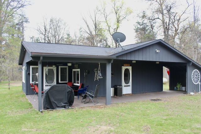 468 Pine Oak Trl, Grayling, MI 49738 - view of front facade with a front lawn and a carport
