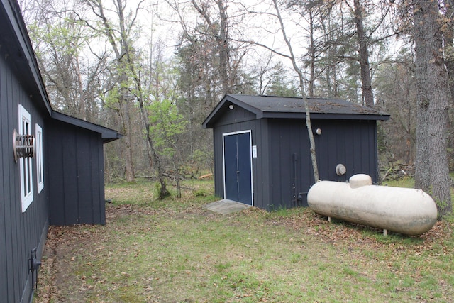 468 Pine Oak Trl, Grayling, MI 49738 - view of shed featuring a wooded view