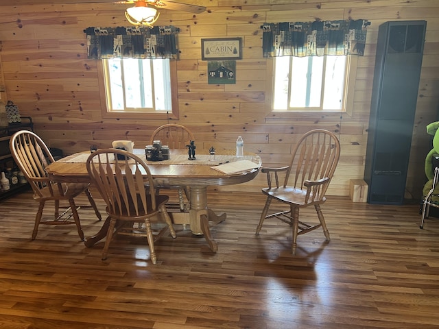 468 Pine Oak Trl, Grayling, MI 49738 - dining area with healthy amount of natural light, wood finished floors, and wooden walls