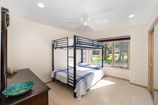 118 Harbor Ct, Houghton Lake, MI 48629 - bedroom with baseboards, light carpet, recessed lighting, and ceiling fan