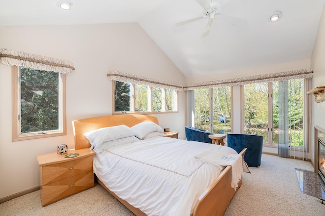 118 Harbor Ct, Houghton Lake, MI 48629 - carpeted bedroom with baseboards, a ceiling fan, recessed lighting, high vaulted ceiling, and a fireplace with flush hearth