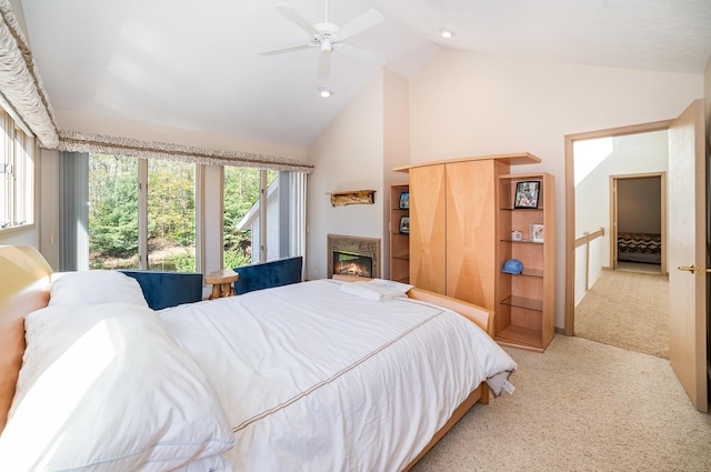 118 Harbor Ct, Houghton Lake, MI 48629 - carpeted bedroom featuring high vaulted ceiling, a glass covered fireplace, ceiling fan, and recessed lighting
