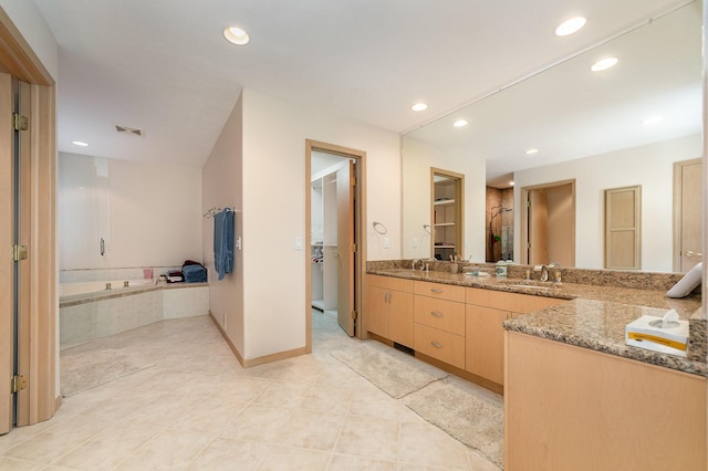 118 Harbor Ct, Houghton Lake, MI 48629 - bathroom featuring double vanity, a bath, tile patterned floors, recessed lighting, and a closet