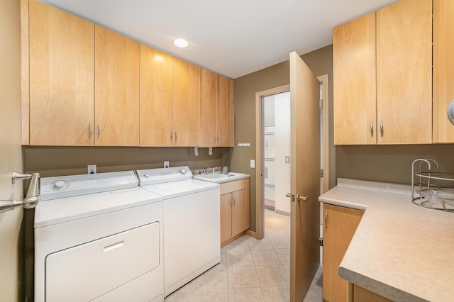 118 Harbor Ct, Houghton Lake, MI 48629 - laundry area with cabinet space, washing machine and clothes dryer, and light tile patterned floors