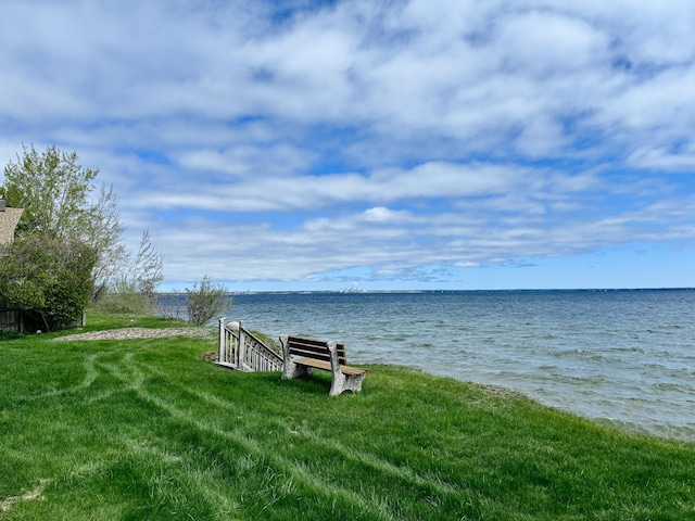 2215 N Partridge Point Rd, Alpena, MI 49707 - surrounding community with a water view and a yard